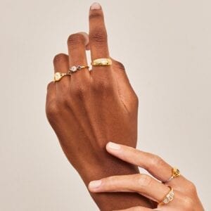 Two hands holding wearing V by Laura Vann